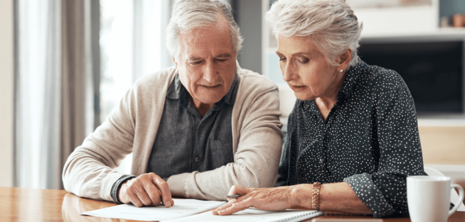 An older couple reviews papers